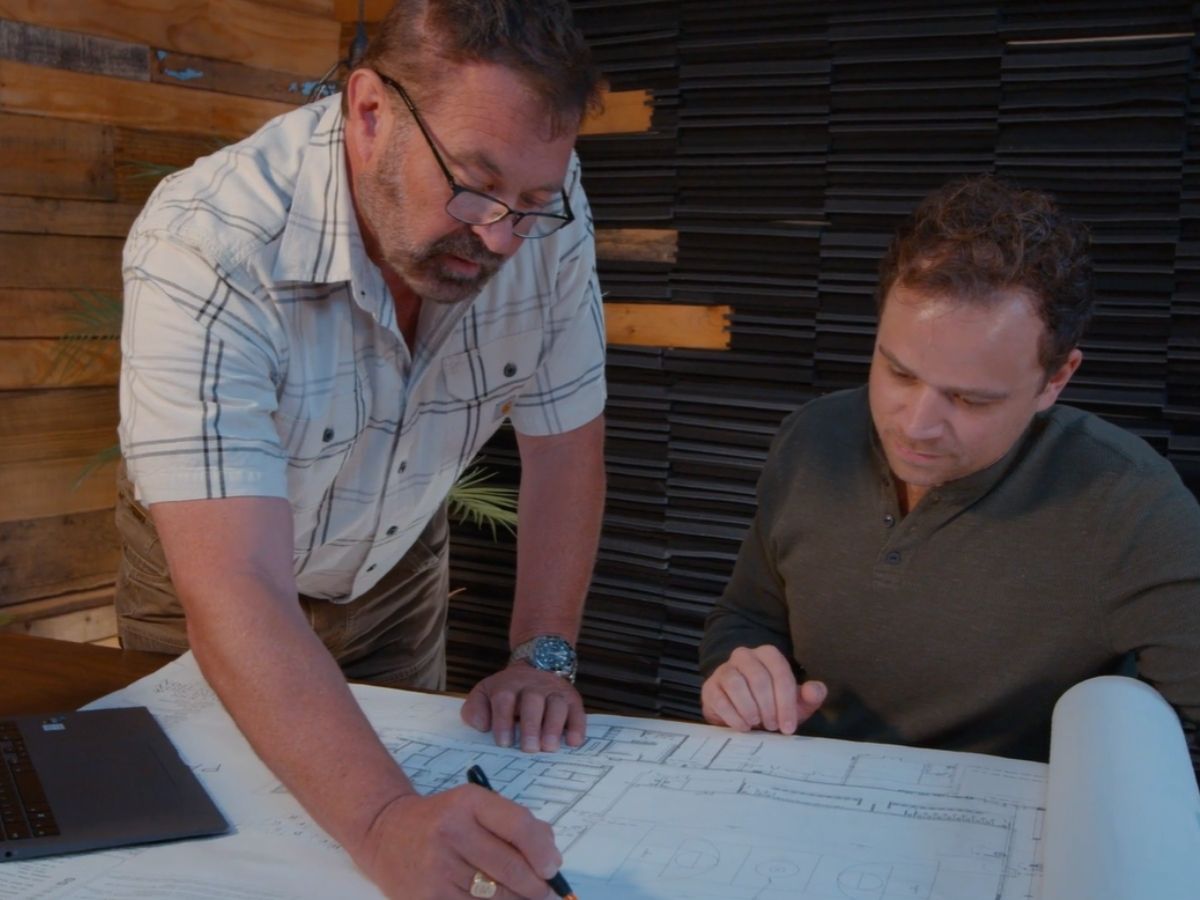 Engineers reviewing project drawings together